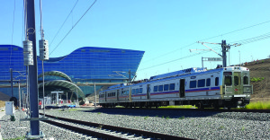 An RTD commuter train rolls outside of the new station on the East Rail line at Denver International Airport during testing in August. - Courtesy RTD